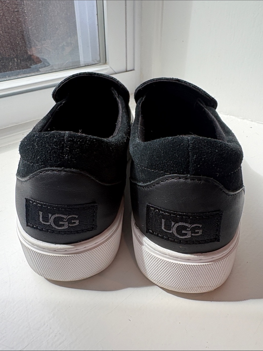 UGG Womens Black Slip-On Sneakers with White Soles